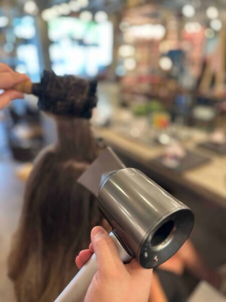 Hairdryer blowing drying a lady's hair